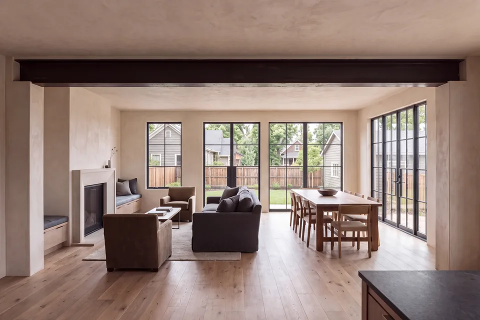 An older home renovated into an open plan with a new steel beam and oak floors